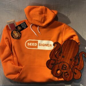 an orange SeedSigner hoodie